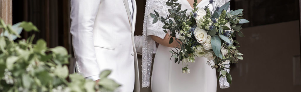 Guipurean Bride Holding Flowers