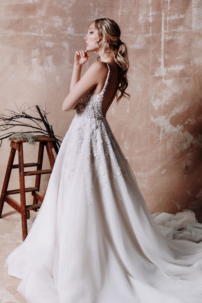 girl side pose with white elora gown