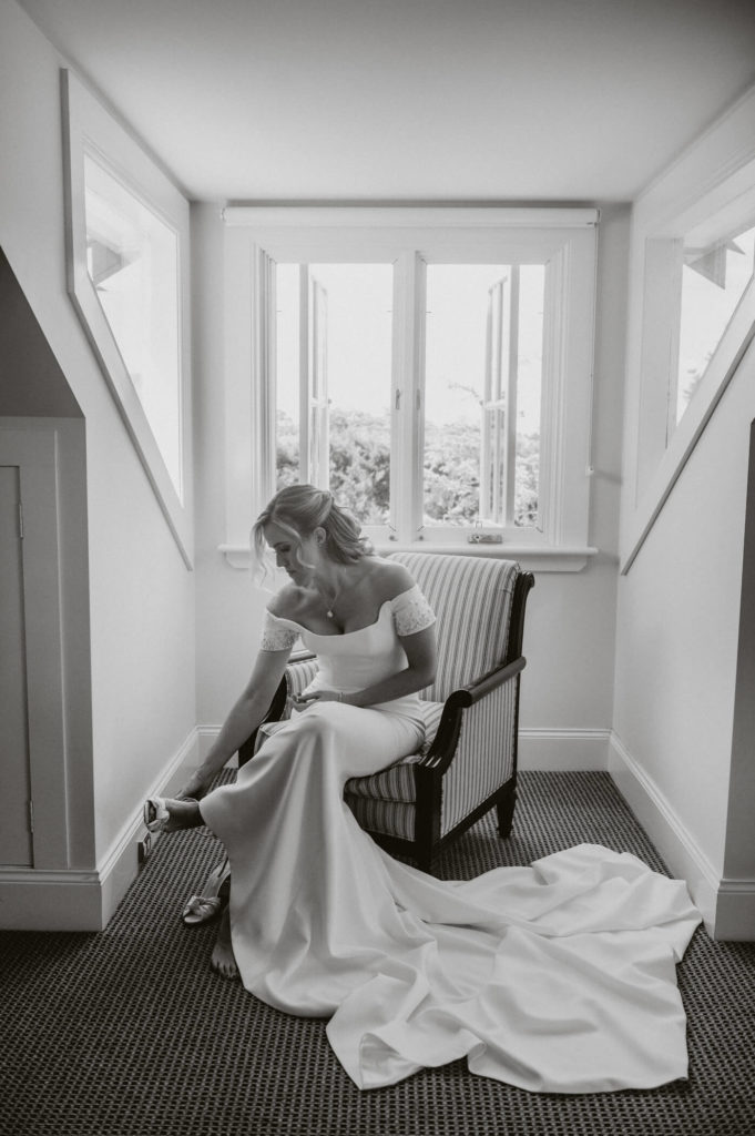 Bride sitting on chair - bridal dresses sydney