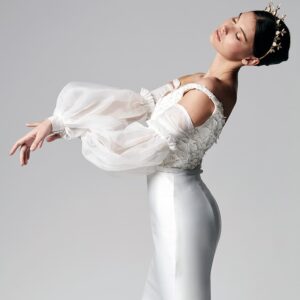 stylish girl pose with swan lake wedding gown